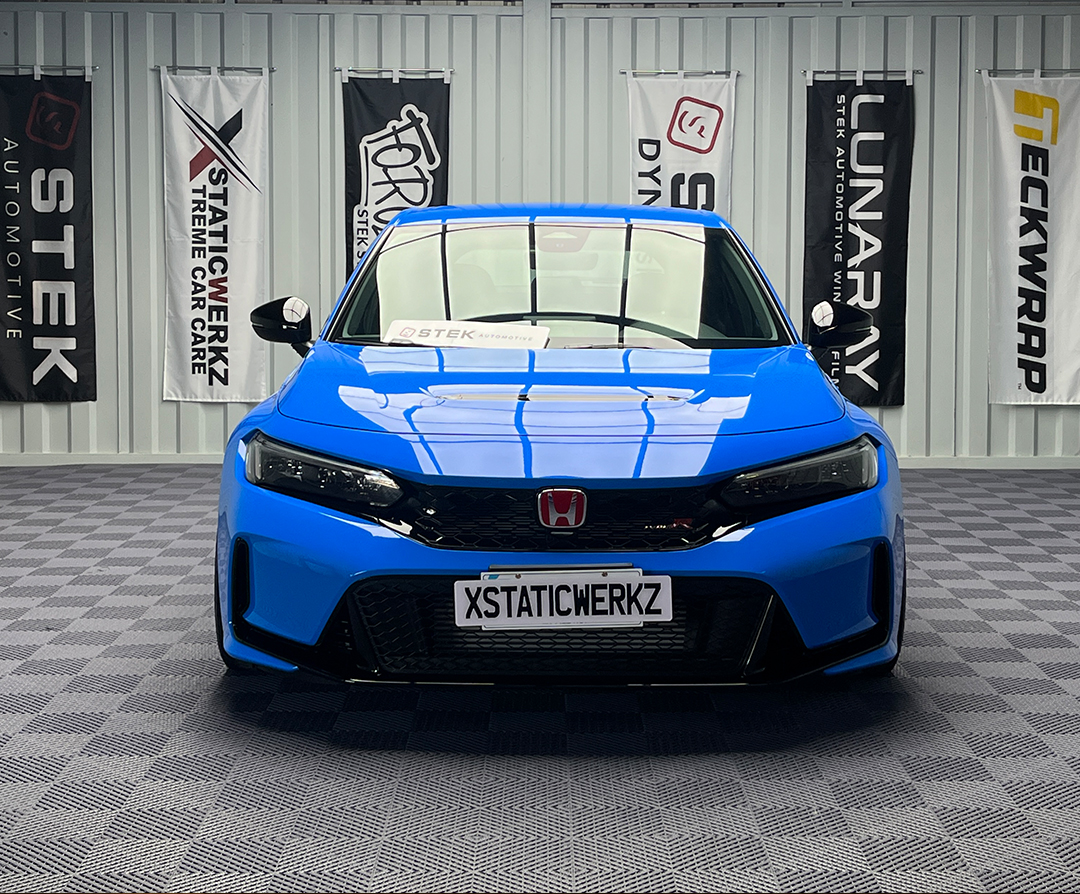 Blue XstaticWerkz sedan showcasing STEK automotive window tint